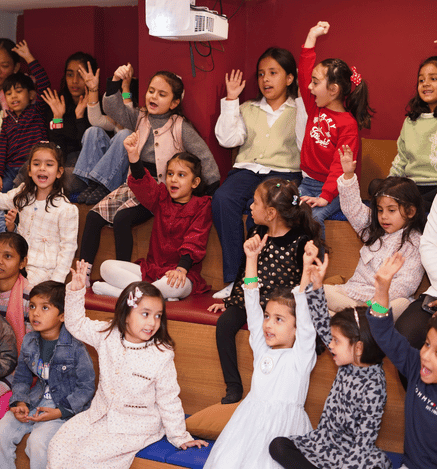Children enjoying an interactive movie experience together at Mio Wooray.